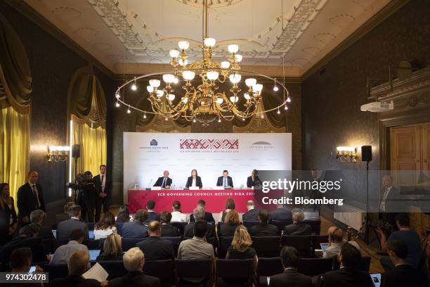 From left, Luis de Guindos, vice president of the European Central Bank , Zoja Razmusa, deputy governor of the Bank of Latvia, Mario Draghi,...