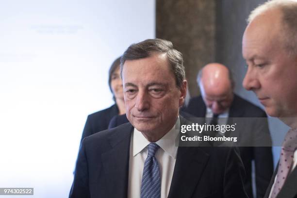 Mario Draghi, president of the European Central Bank , departs the ECB rate decision news conference at the Latvian central bank, also known as...