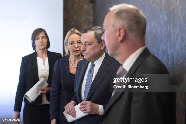 Mario Draghi, president of the European Central Bank , second left, Zoja Razmusa, deputy governor of the Bank of Latvia, right, and Christine Graeff,...