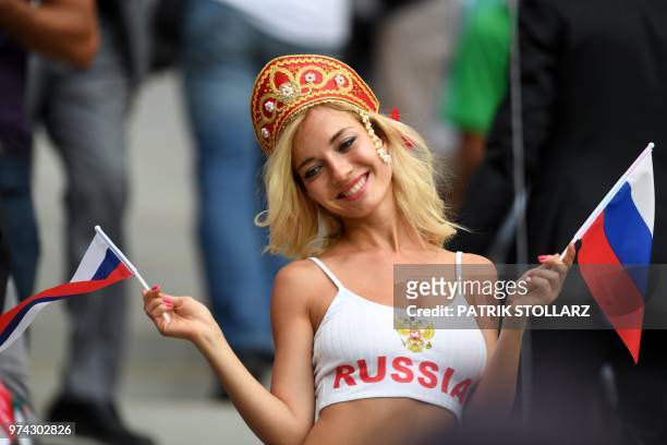 Russia fan poses before the start of the Russia 2018 World Cup Group A football match between Russia and Saudi Arabia at the Luzhniki Stadium in...