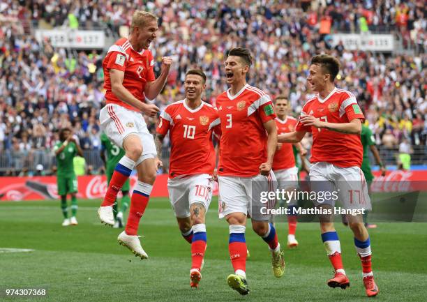 Iury Gazinsky of Russia celebrates with teammates Fedor Smolov, Ilya Kutepov and Aleksandr Golovin after scoring the opening goal during the 2018...