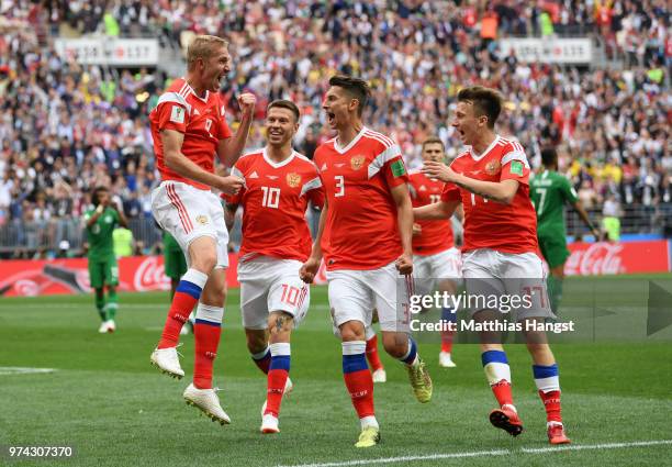 Iury Gazinsky of Russia celebrates with teammates Fedor Smolov, Ilya Kutepov and Aleksandr Golovin after scoring the opening goal during the 2018...