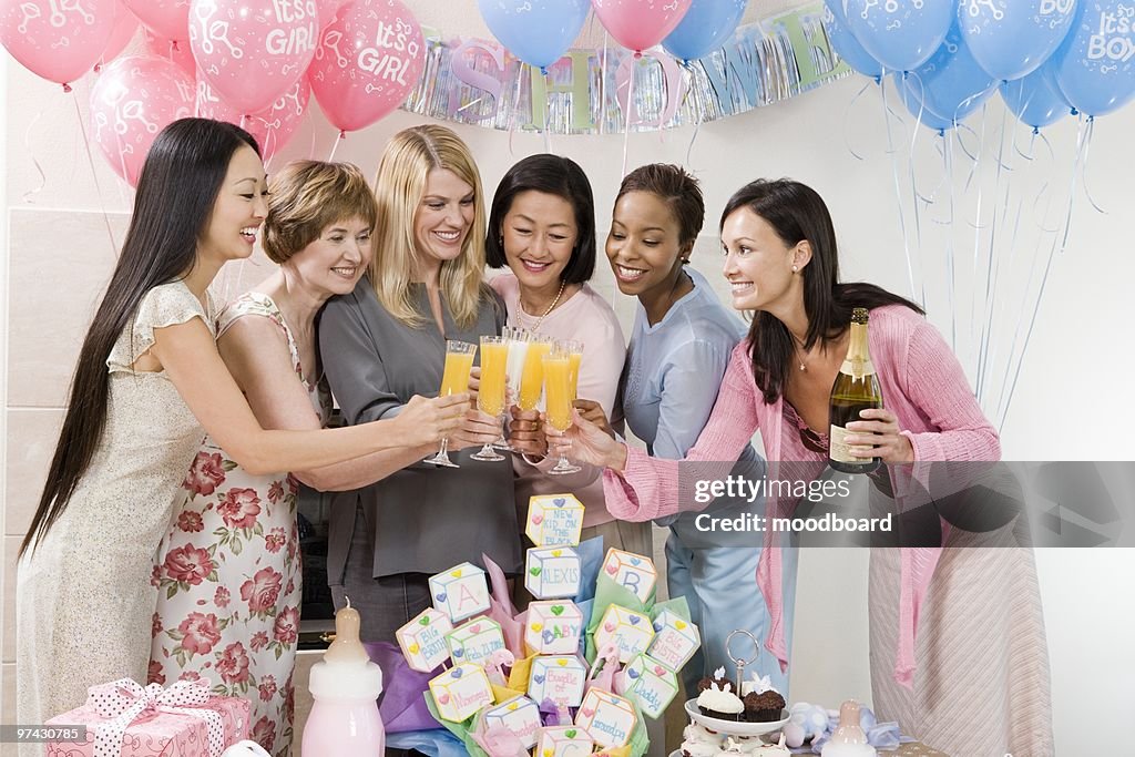 Women toasting drinks at a Baby Shower