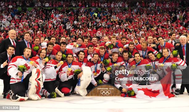 Canadian players attend the medal ceremony after their victory over the US in the men's gold medal Ice Hockey match against the US at Canada Hockey...