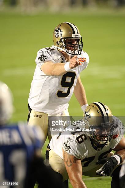 Drew Brees of the New Orleans Saints at the line of scrimmage during Super Bowl XLIV against the Indianapolis Colts at Sun Life Stadium on February...