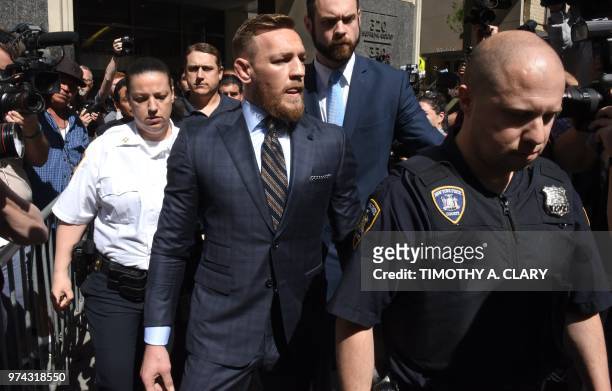 Mixed martial arts fighter Conor McGregor leaves Brooklyn Supreme court in New York on June 14 after his hearing stemming from his April attack on a...