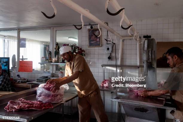 Workers prepare pork for delivery at the Obrador Muoz meat wholesale and distribution center in San Luis Potosi, Mexico, on Friday, June 8, 2018....