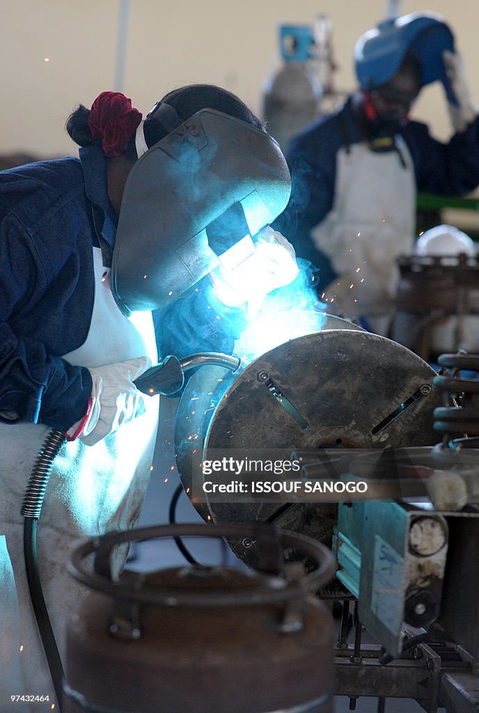 A man welds on November 13, 2009, in Abi