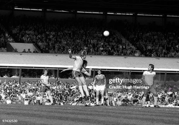 Steve Wicks of Chelsea clears the ball from danger watched by team-mates Ray Lewington and Ray Wilkins during the Football League Division One match...