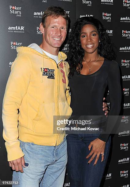 Former English footballer Teddy Sheringham and singer Kelly Rowland arrive at the amfAR Cocktail Party & PokerStars Red Carpet And Party at Aura...