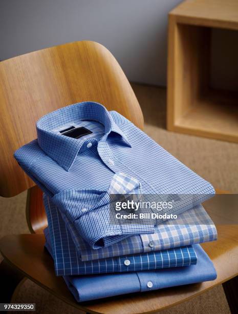 stack of 4 dress shirts - shirt stock pictures, royalty-free photos & images