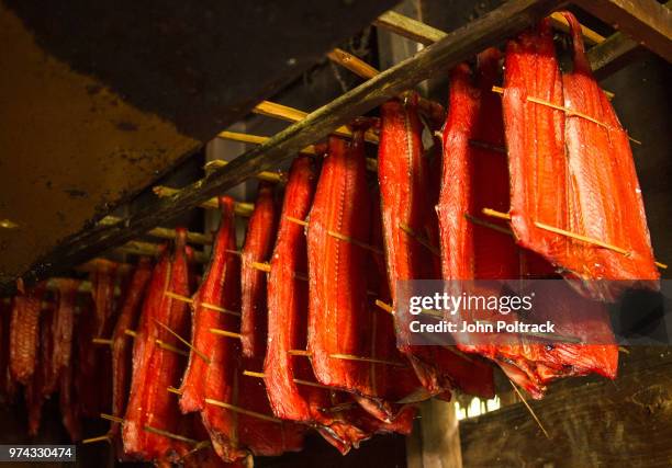 strips of salmon being smoked - smokehouse stock pictures, royalty-free photos & images