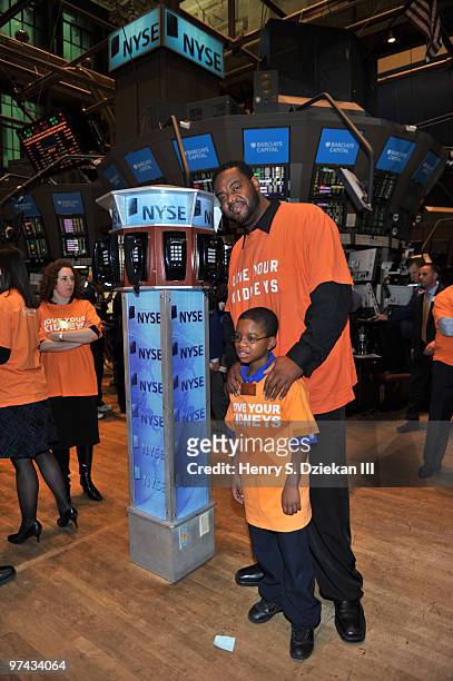 Christian Chapman and Actor Grizz Chapman pose for pictures on the trading floor after ringing the opening bell at the New York Stock Exchange on...