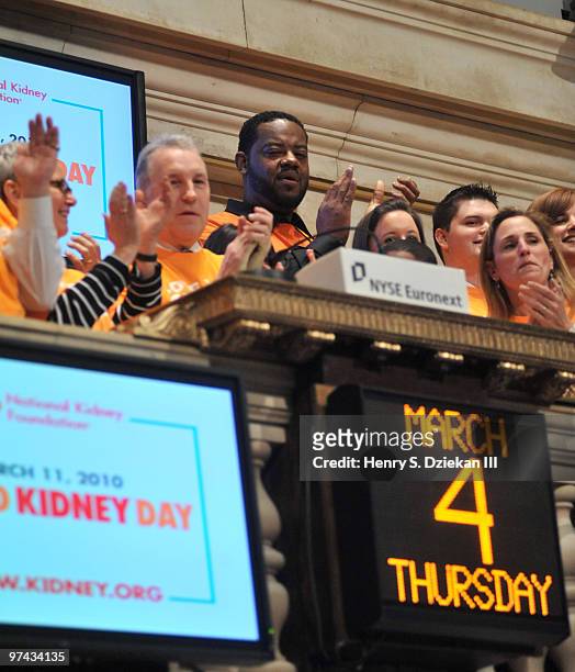 Chairman of National Kidney Foundation Bill Cella and Actor Grizz Chapman ring the opening bell at the New York Stock Exchange on March 4, 2010 in...