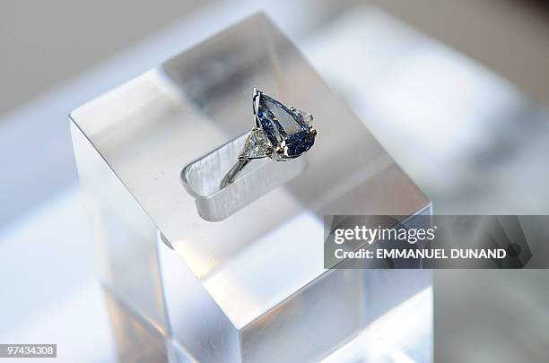 Carat pear-shaped internally flawless vivid blue diamond is displayed at Sotheby�s in New York, on March 4, 2010. The diamond, formerly in the...