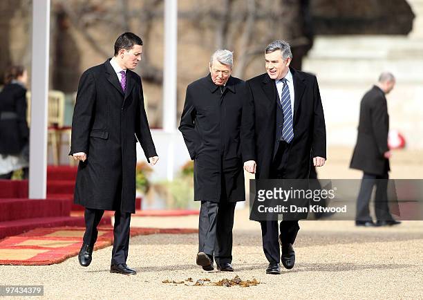 British Prime Minister Gordon Brown returns to his Downing Street residence with Home Secretary Alan Johnson and Foreign Secratary David Miliband...