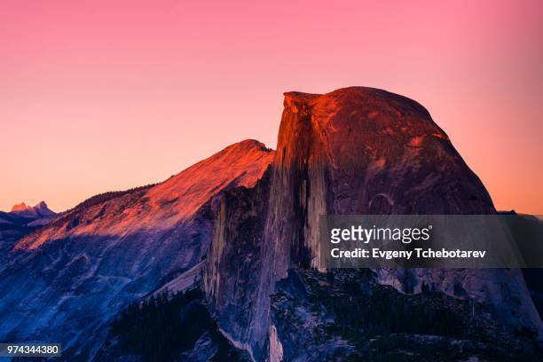 half dome at colorful sunset, california, usa - half dome stock-fotos und bilder
