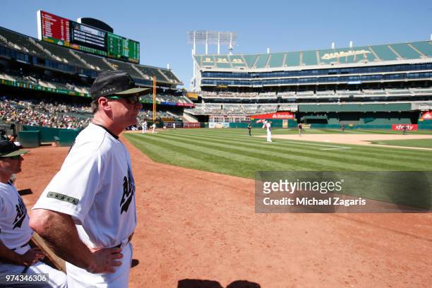 Manager Bob Melvin of the Oakland Athletics stands in the dugout during the game against the Arizona Diamondbacks at the Oakland Alameda Coliseum on...