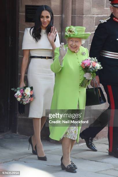 Queen Elizabeth II and Meghan, Duchess of Sussex leaving Chester Town Hall on June 14, 2018 in Chester, England. Meghan Markle married Prince Harry...