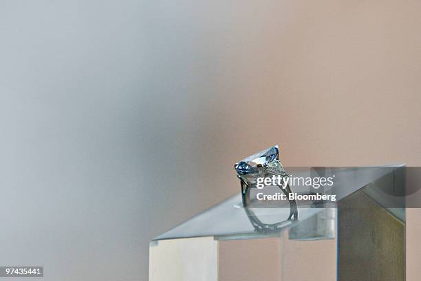 Ring containing a rare 5.16 carat pear shaped blue diamond is displayed for a photograph at Sotheby's in New York, U.S., on Thursday, March 4, 2010....