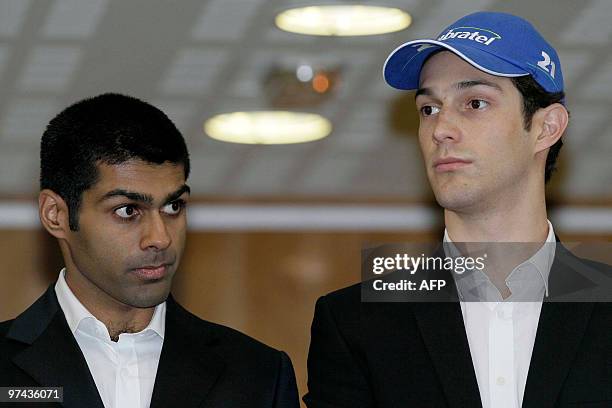 Spanish "Hispania" team drivers Brazilian Bruno Senna and Indian Karun Chandhok pose during the presentation of the new Formula 1 car in Murcia on...