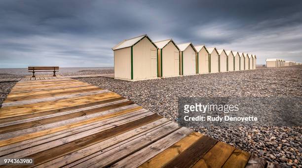 beach houses in a row near wooden pathway, cayeux-sur-mer, somme, picardie, france - hauts de france fotografías e imágenes de stock
