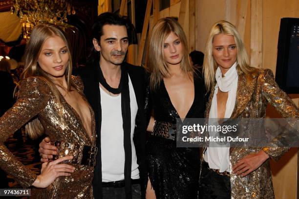 Christophe Decarnin poses with models backstage during the Balmain Ready to Wear show as part of the Paris Womenswear Fashion Week Fall/Winter 2011...