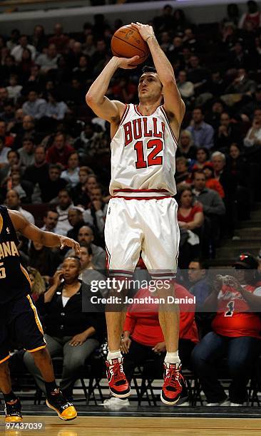 Kirk Hinrich of the Chicago Bulls smilkes puts up a shot against the Indiana Pacers at the United Center on February 24, 2010 in Chicago, Illinois....