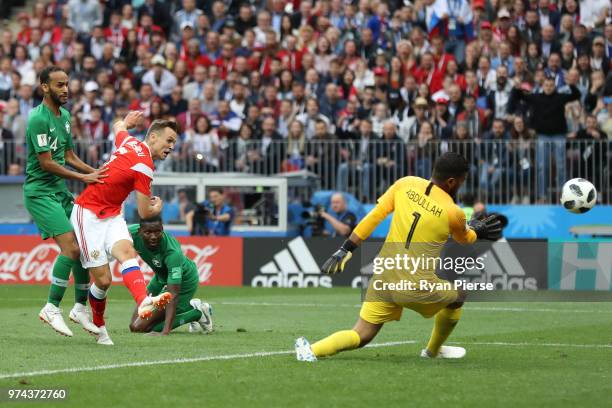 Denis Cheryshev of Russia scores his sides second goal pass Abdullah Almuaiouf of Saudi Arabia during the 2018 FIFA World Cup Russia Group A match...