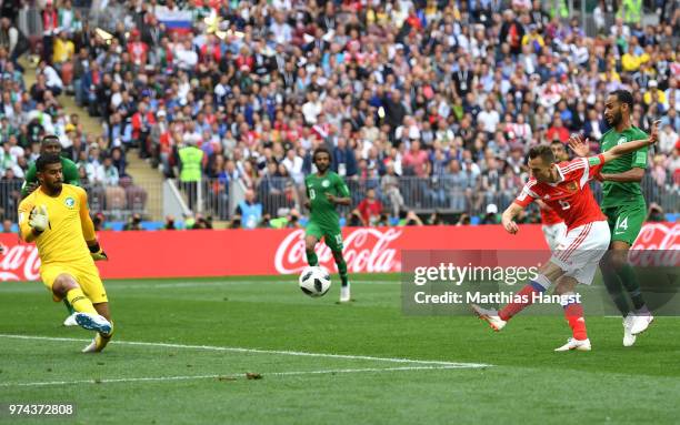 Denis Cheryshev of Russia scores his sides second goal pass Abdullah Almuaiouf of Saudi Arabia during the 2018 FIFA World Cup Russia Group A match...