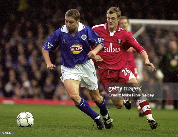 Steve Guppy of Leicester City fends off Mathias Svensson of Charlton Athletic during the FA Carling Premiership match against Charlton Athletic at...