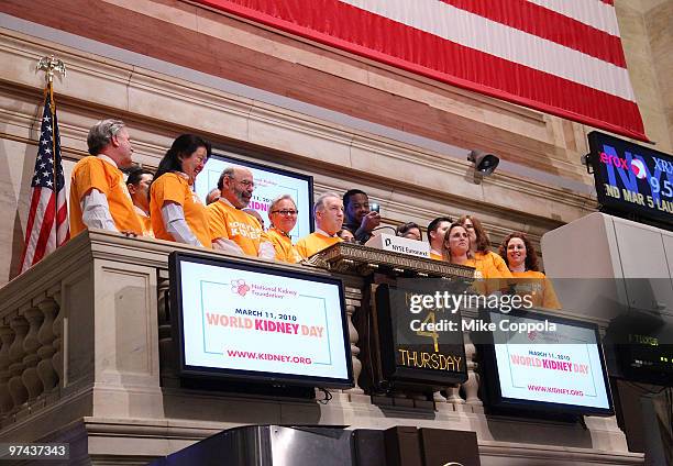 Chairman of National Kidney Foundation Bill Cella and actor Grizz Chapman ring the opening bell at the New York Stock Exchange on March 4, 2010 in...