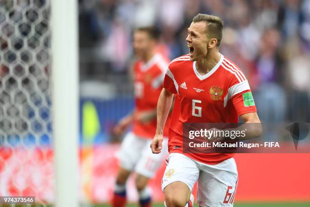 Denis Cheryshev of Russia celebrates after scoring his team's second goal during the 2018 FIFA World Cup Russia Group A match between Russia and...