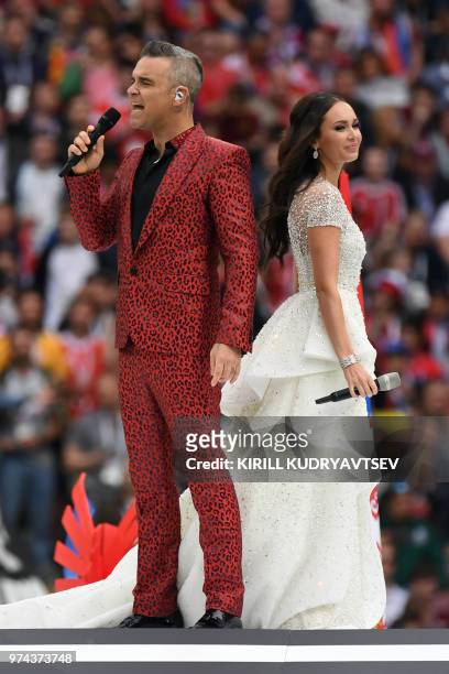 English singer Robbie Williams and Russian soprano Aida Garifullina perform during the Opening Ceremony before the Russia 2018 World Cup Group A...