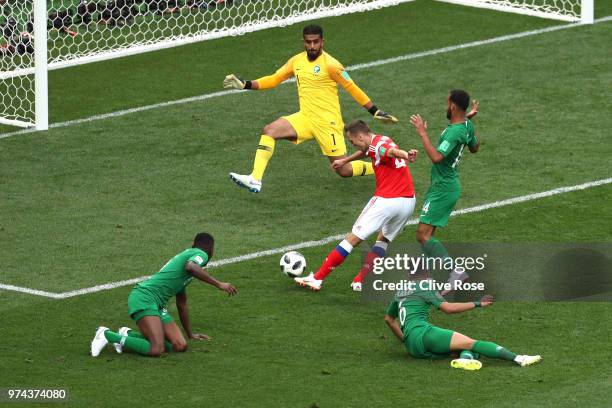 Denis Cheryshev of Russia scores his sides second goal pass Abdullah Almuaiouf of Saudi Arabia during the 2018 FIFA World Cup Russia Group A match...