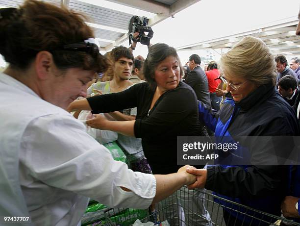 Chilean President Michelle Bachelet greets volunteers during her arrival to a humanitary aid center in Concepcion, Chile on March 04, 2010. The...