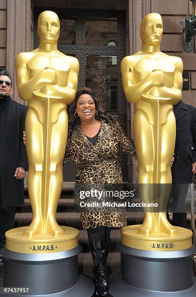 Personality Sherri Shepherd poses between the two eight-foot golden Oscar statues delivered for the official Academy of Motion Picture Arts and...