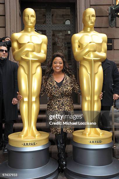 Personality Sherri Shepherd poses between the two 8-foot golden Oscar statues delivered for the official Academy of Motion Picture Arts and Sciences...