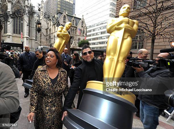 Personality Sherri Shepherd poses between the two eight-foot golden Oscar statues delivered for the official Academy of Motion Picture Arts and...