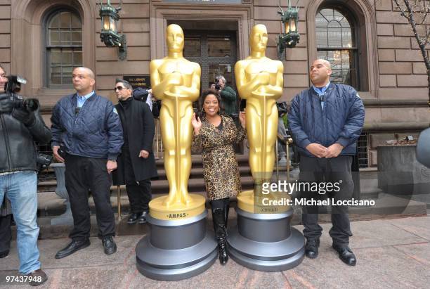 Personality Sherri Shepherd poses between the two 8-foot golden Oscar statues delivered for the official Academy of Motion Picture Arts and Sciences...