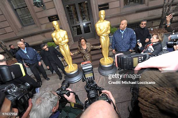 Personality Sherri Shepherd poses between the two 8-foot golden Oscar statues delivered for the official Academy of Motion Picture Arts and Sciences...