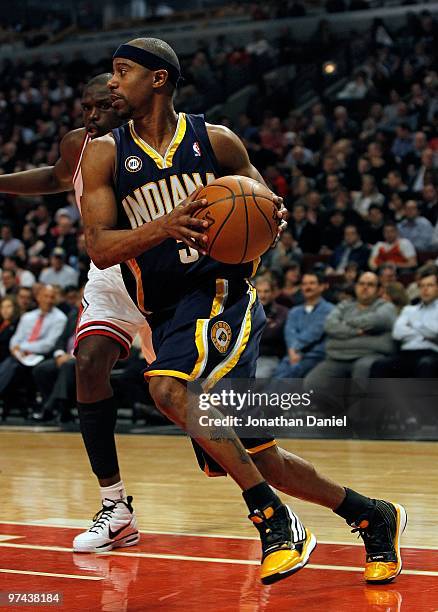 Ford of the Indiana Pacers moves past Loul Deng of the Chicago Bulls at the United Center on February 24, 2010 in Chicago, Illinois. The Bulls...