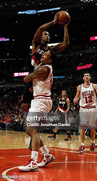 Dante Cunningham of the Portland Trail Blazers shoots over James Johnson of the Chicago Bulls at the United Center on February 26, 2010 in Chicago,...