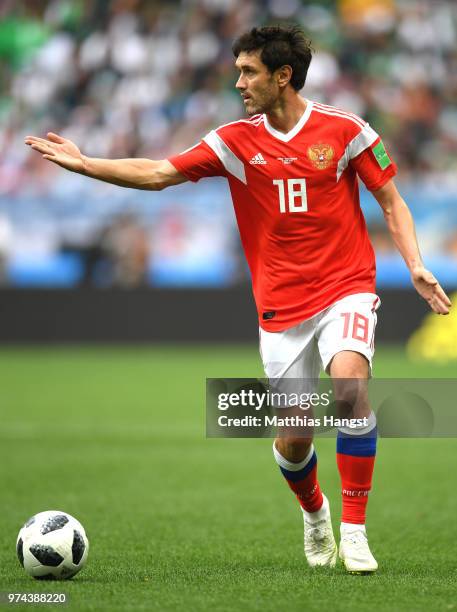 Yury Zhirkov of Russia runs with the ball during the 2018 FIFA World Cup Russia Group A match between Russia and Saudi Arabia at Luzhniki Stadium on...