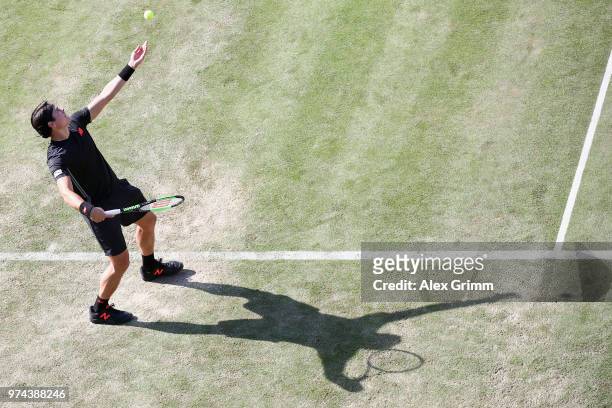 Milos Raonic of Canada serves the ball to Marton Fucsovics of Hungary during day 4 of the Mercedes Cup at Tennisclub Weissenhof on June 14, 2018 in...
