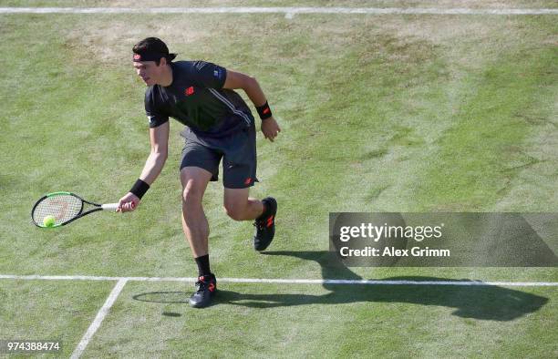 Milos Raonic of Canada plays a forehand to Marton Fucsovics of Hungary during day 4 of the Mercedes Cup at Tennisclub Weissenhof on June 14, 2018 in...