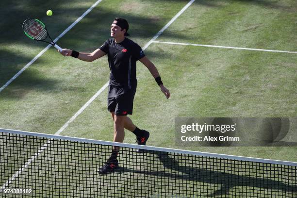 Milos Raonic of Canada plays a forehand to Marton Fucsovics of Hungary during day 4 of the Mercedes Cup at Tennisclub Weissenhof on June 14, 2018 in...