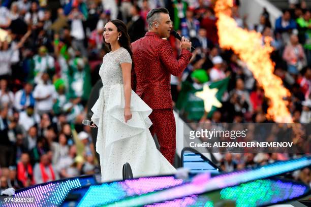 English singer Robbie Williams and Russian soprano Aida Garifullina perform during the opening ceremony before the Russia 2018 World Cup Group A...