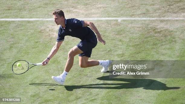 Marton Fucsovics of Hungary plays a forehand to Milos Raonic of Canada during day 4 of the Mercedes Cup at Tennisclub Weissenhof on June 14, 2018 in...
