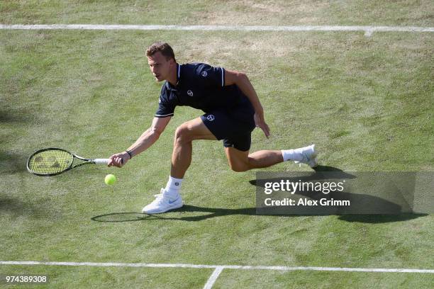 Marton Fucsovics of Hungary plays a forehand to Milos Raonic of Canada during day 4 of the Mercedes Cup at Tennisclub Weissenhof on June 14, 2018 in...